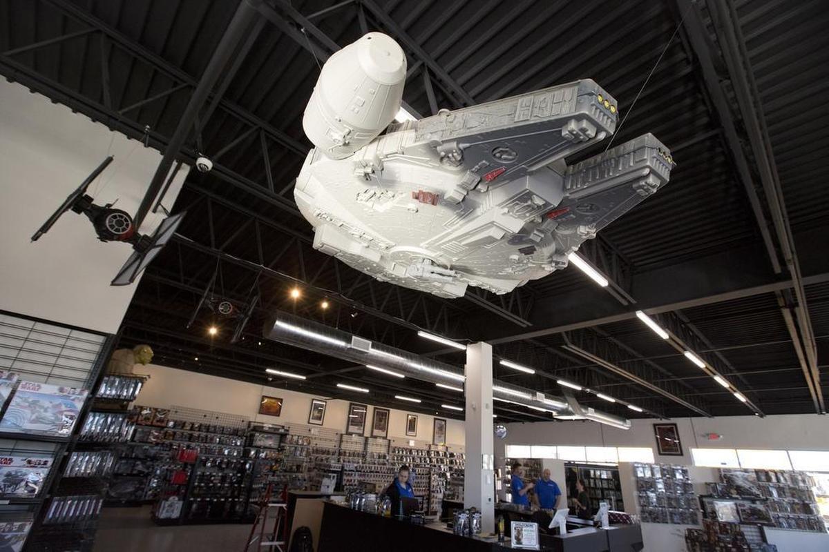 The Millennium Falcon on the ceiling is a 1996 Toys R Us giveaway, No. 582 of 700, and is one of maybe 15 left in this condition.