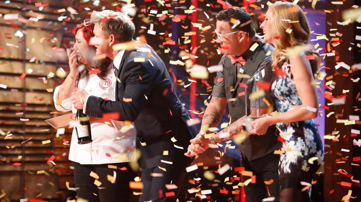 Claudia Sandoval gets the news from Gordon Ramsay that she has won as confetti drops.