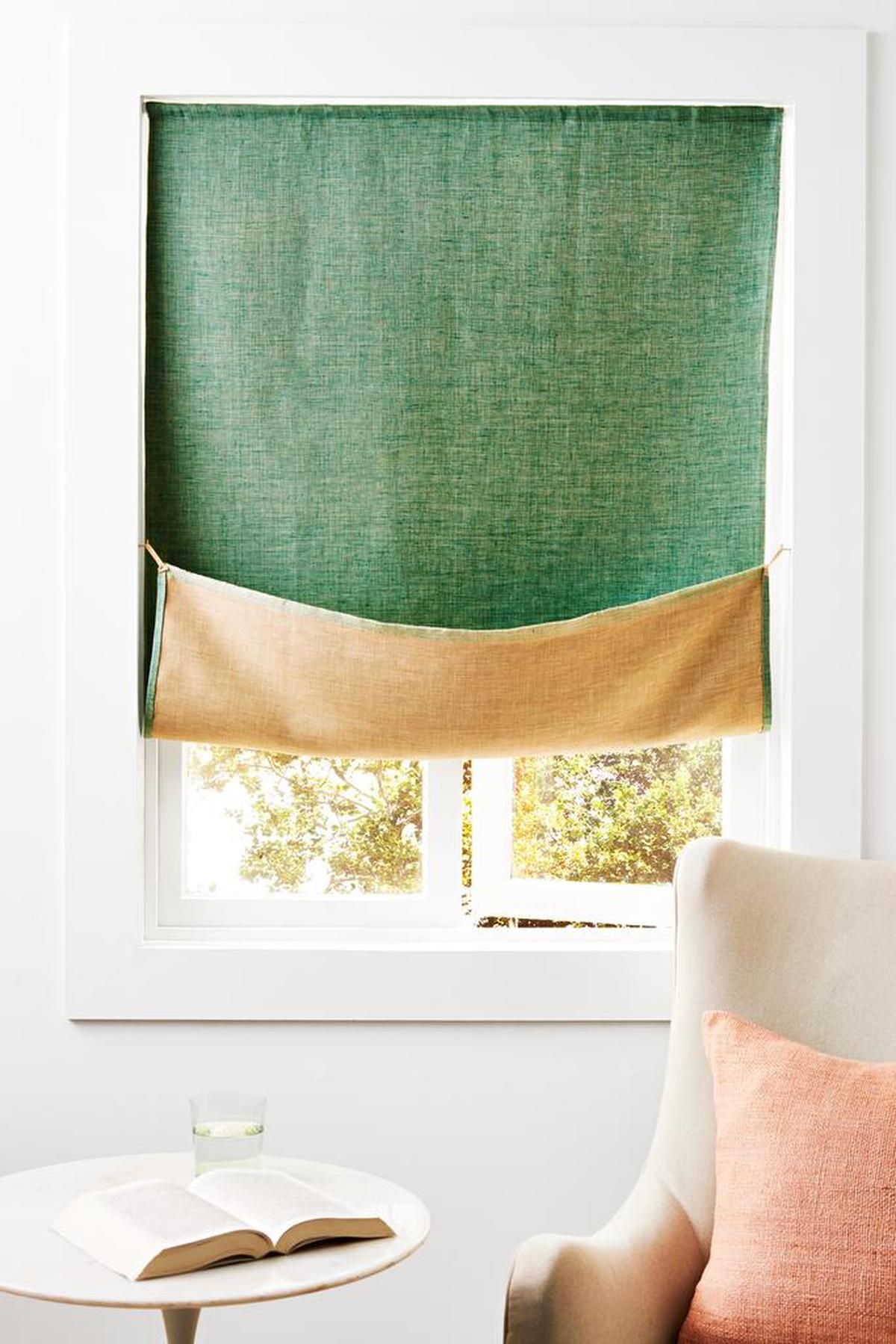 To keep the curtain folded up, double a 3-inch piece of twill tape to make a loop.