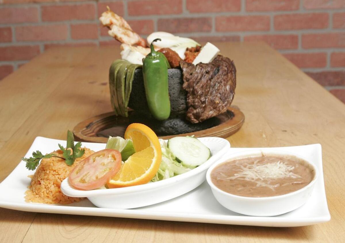 Molcajete Yucateco with rice, beans and a salad at Chalio Mexican Resturant in south Fort Worth