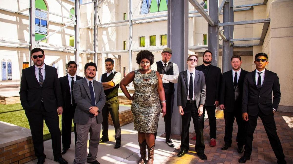 Kam Franklin, center, fronts the Suffers