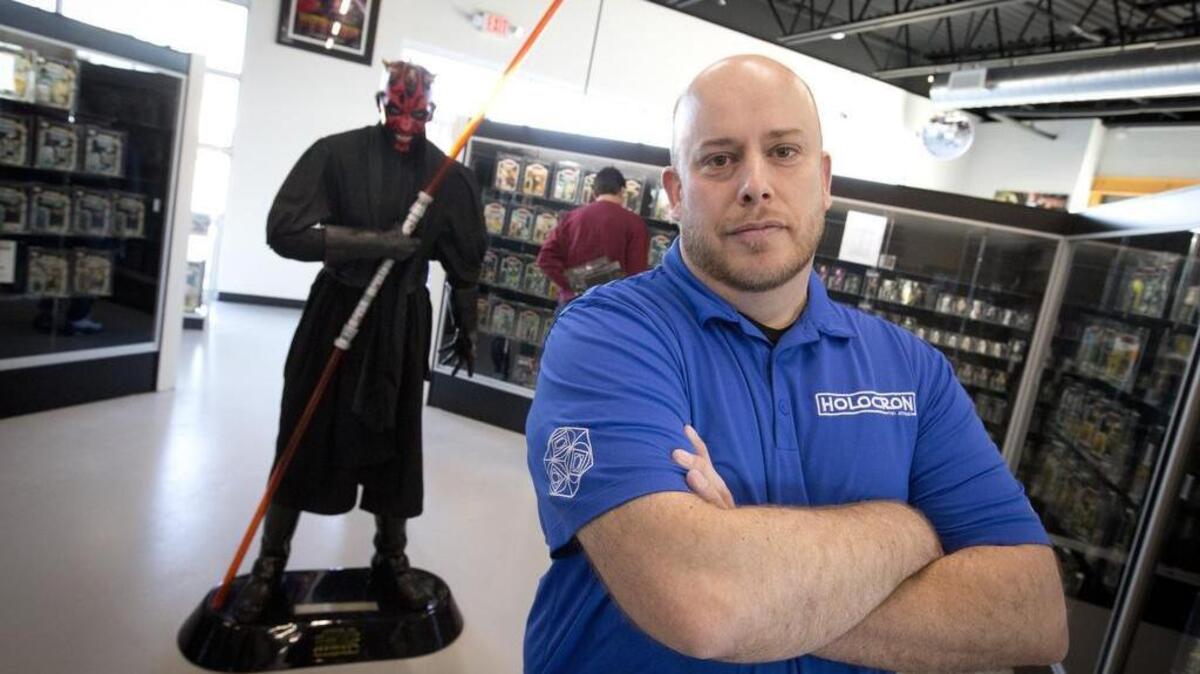 General manager Rob Fisher poses with a life-size Darth Maul figure at Holocron Toy Store in Fort Worth on Wednesday.