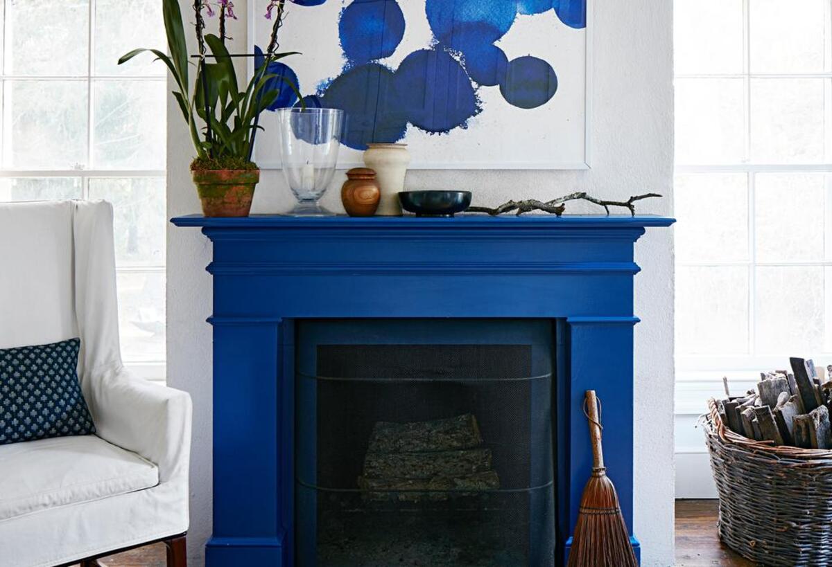 Choose art that’s roughly the size of the firebox, in a color that plays up your accent paint.
