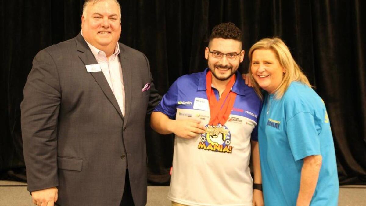 Angel Diaz, middle, won his fourth-straight local Maintenance Mania competition in Arlington in February.