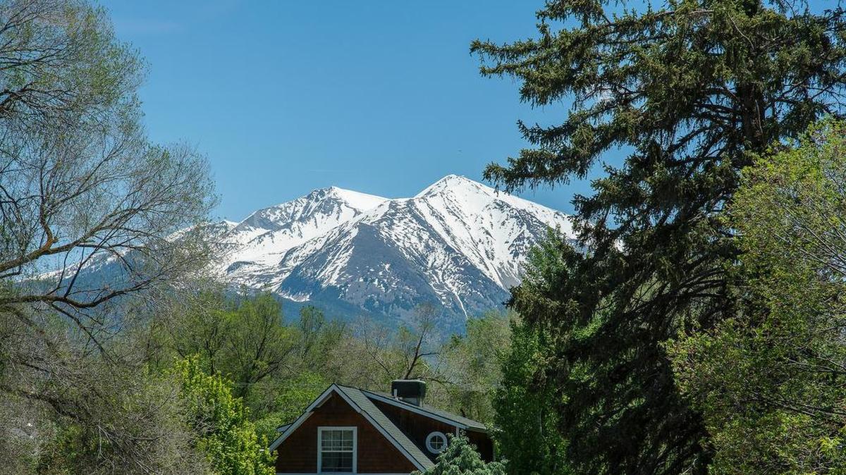 Mount Sopris rises over the Marble Distillery Inn.