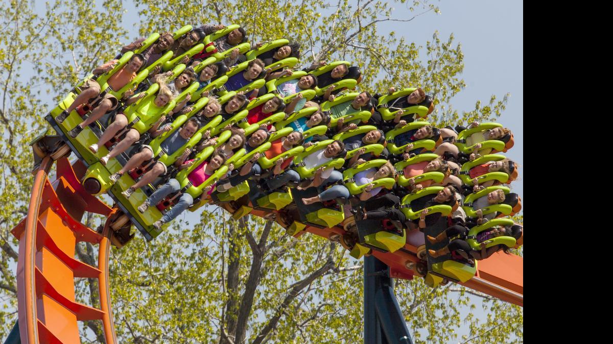 
This photo provided by Cedar Point in Sandusky, Ohio, shows the theme park’s new Rougarou roller coaster. The floorless coaster has a werewolf theme. It’s one of a number of new attractions at theme parks around the country this summer. 
