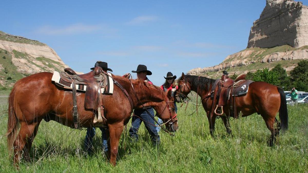 In this 2016 photo, riders in the annual Pony Express Re-Ride from St. Joseph, Mo. to Sacramento, Calif., exchanged their mail delivery at Scotts Bluff National Monument in Nebraska.