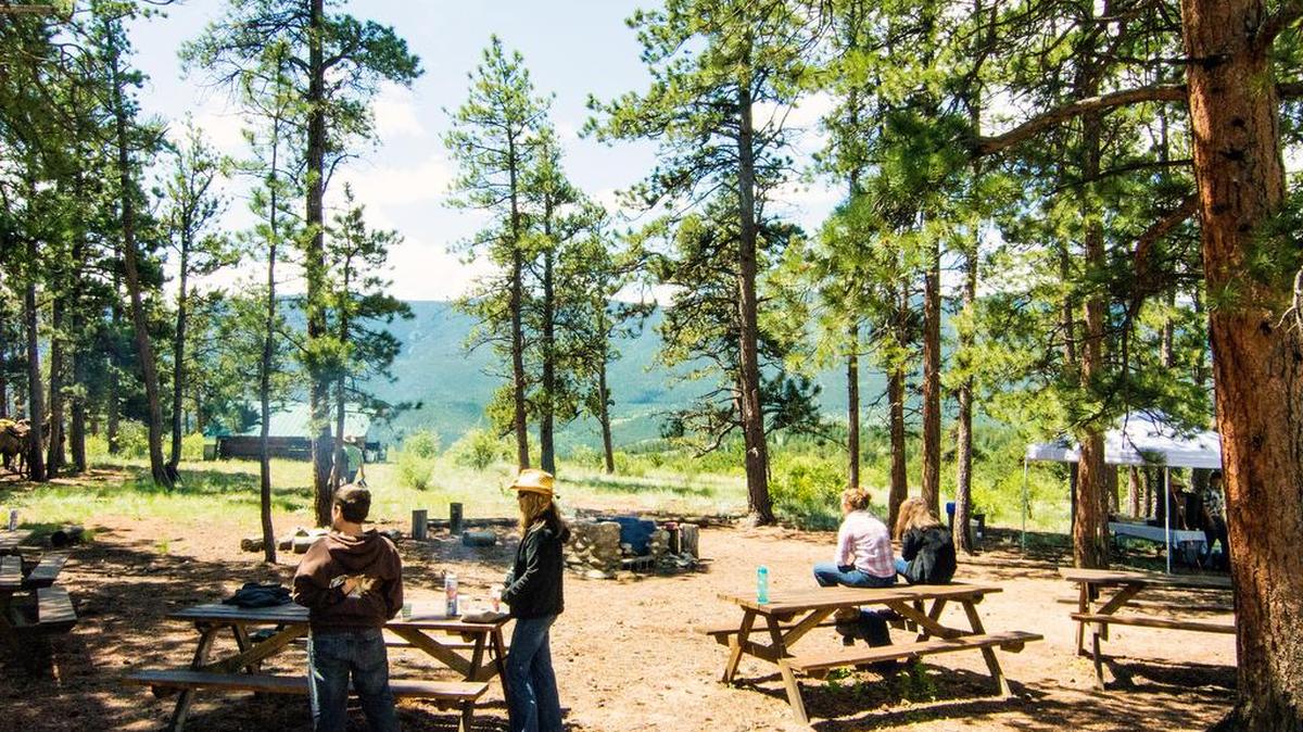 A mountain top picnic lunch breaks up a full day ride at the North Fork Ranch.
