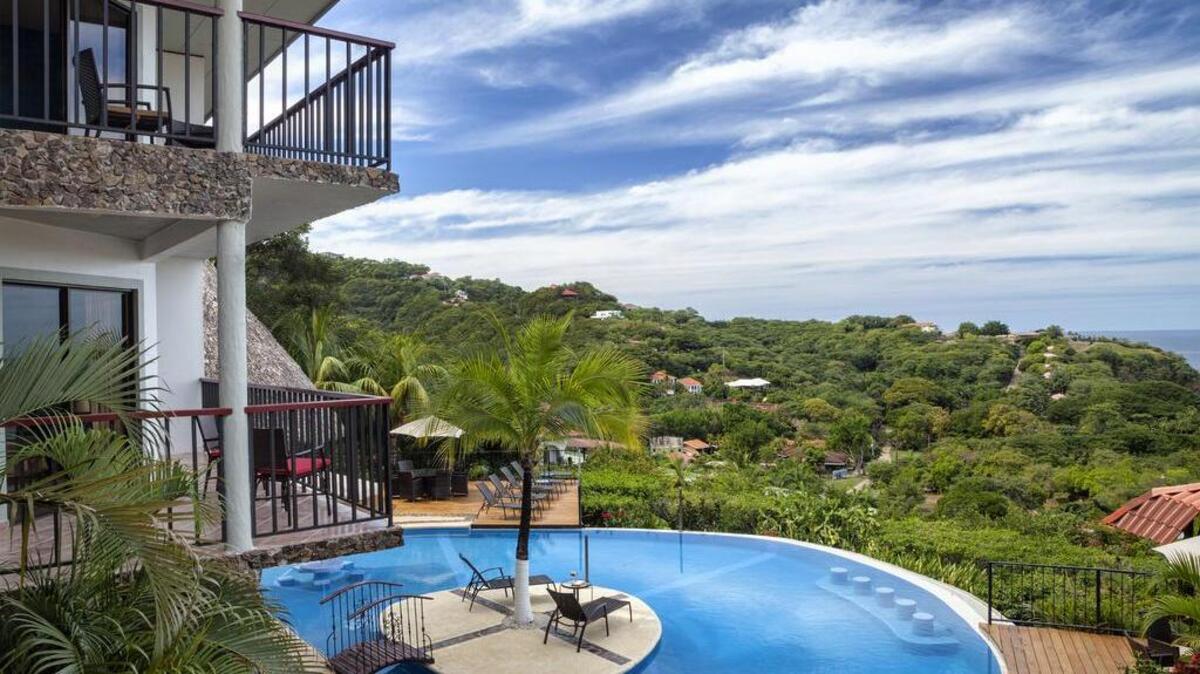 Each of the side bedrooms has its own balcony with Pacific views.