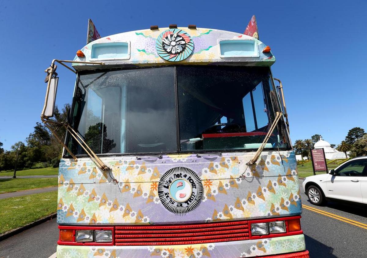 The psychedelic Magic Bus tour makes a stop near the Conservatory of Flowers in San Francisco’s Golden Gate Park.