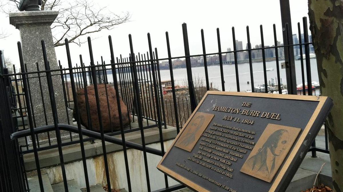 A plaque and bust of Hamilton are near the dueling grounds in Weehawken, N.J., where he was shot .