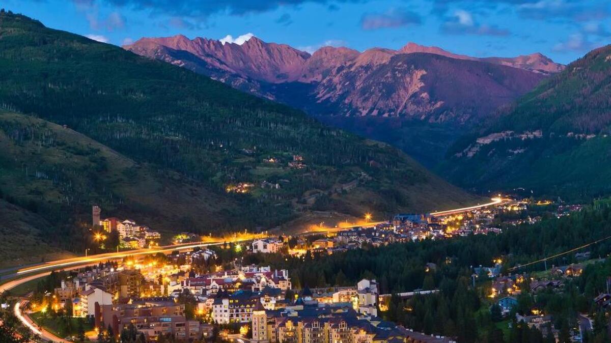 Green, pastoral slopes that would be crowded with skiers and snowboarders in winter enfold the village of Vail in the summertime.
