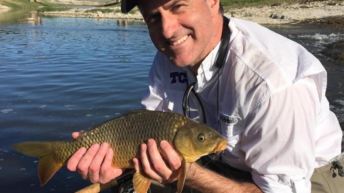 Mac Engel shows off his catch on the Trinity River.