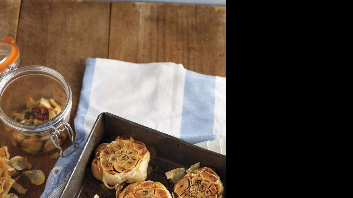 
 A pan and a jar of roasted garlic: Keep it handy. Roasted garlic adds depth and flavor to almost any dish, including vegetables.
