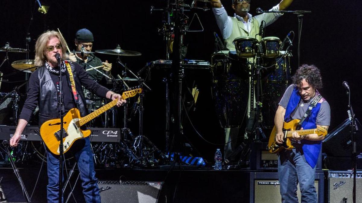 Daryl Hall and John Oates of Hall and Oates at Gexa Energy Pavilion in Dallas. In background are drummer Brian Dunne and percussionist Porter Carroll