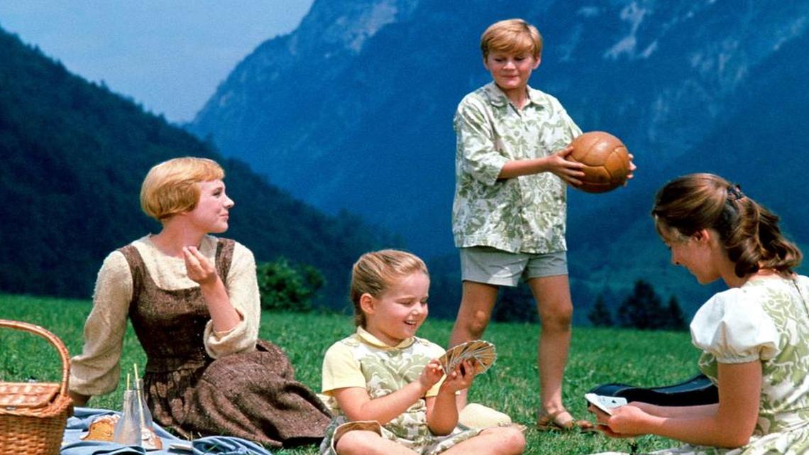 This photo provided by Twentieth Century Fox Home Entertainment shows, from left, Julie Andrews, as Maria, Kym Karath, as Gretl, Duane Chase, as Kurt, and Chairmian Carr, as Liesl, in a scene during the song, “Do-Re-Mi” from the film, “The Sound of Music.” The 1965 Oscar-winning film adaptation of the Rodgers & Hammerstein musical “The Sound of Music” is celebrating its 50th birthday this year. To honor the milestone, 20th Century Fox is releasing a five-disc Blu-ray/DVD/Digital HD collector’s edition, the soundtrack is being re-released, the film will be screened at the TCM Classic Film Festival in Hollywood later this month and to over 500 movie theaters in April 2015. (AP Photo/Twentieth Century Fox Home Entertainment)