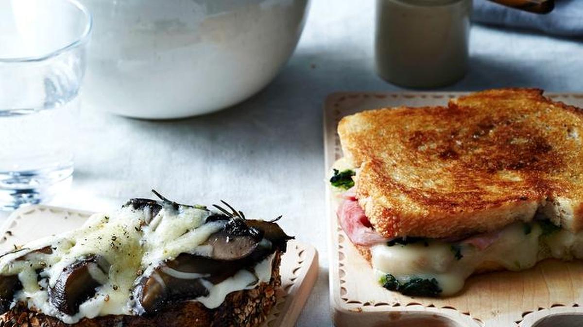 (Left) A roasted portobello melt tops a hearty slice of rustic toast with a creamy béchamel sauce and roasted portobello mushrooms with Gruyère, known for its beefy, browned-butter character. (Right) A grilled ham and broccoli rabe sandwich employs the buttery ooze of Italian fontina.
