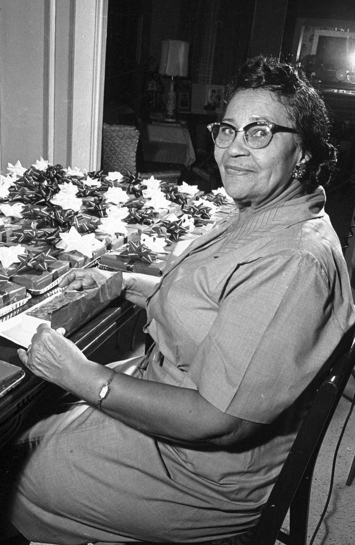 Baker and businesswoman Lucille Bishop Smith prepares 300 fruitcakes as Christmas gifts for Tarrant County servicemen in Vietnam in 1965. She was the first African-American woman to join the Fort Worth Chamber of Commerce.