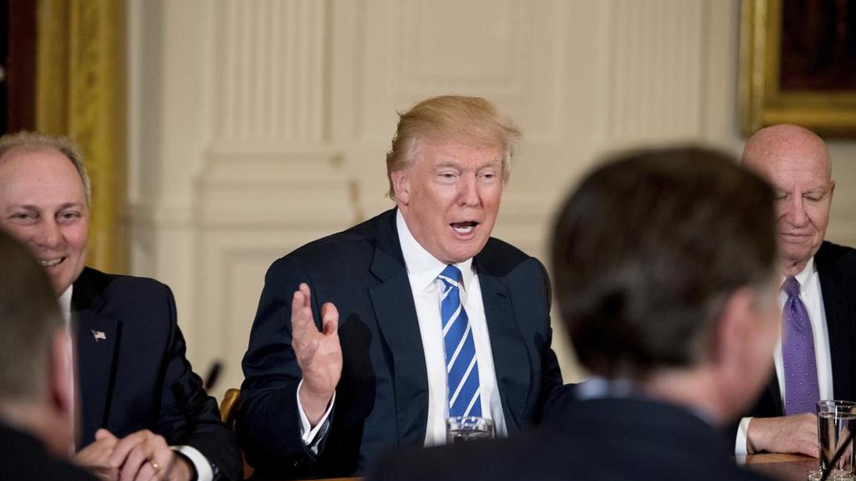 President Donald Trump discusses the proposed healthcare bill with other Republicans last week.