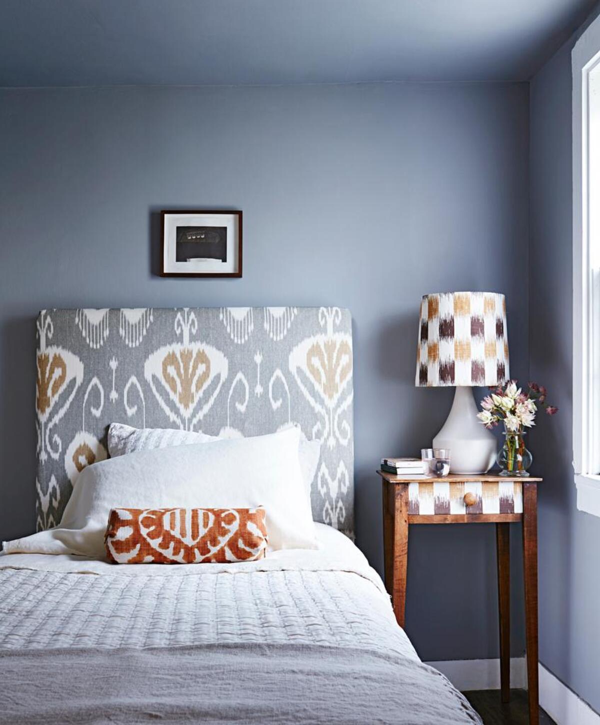 Add some interest to your bedroom with a medley of patterns. You can go bolder, as in this room, or be more subtle.