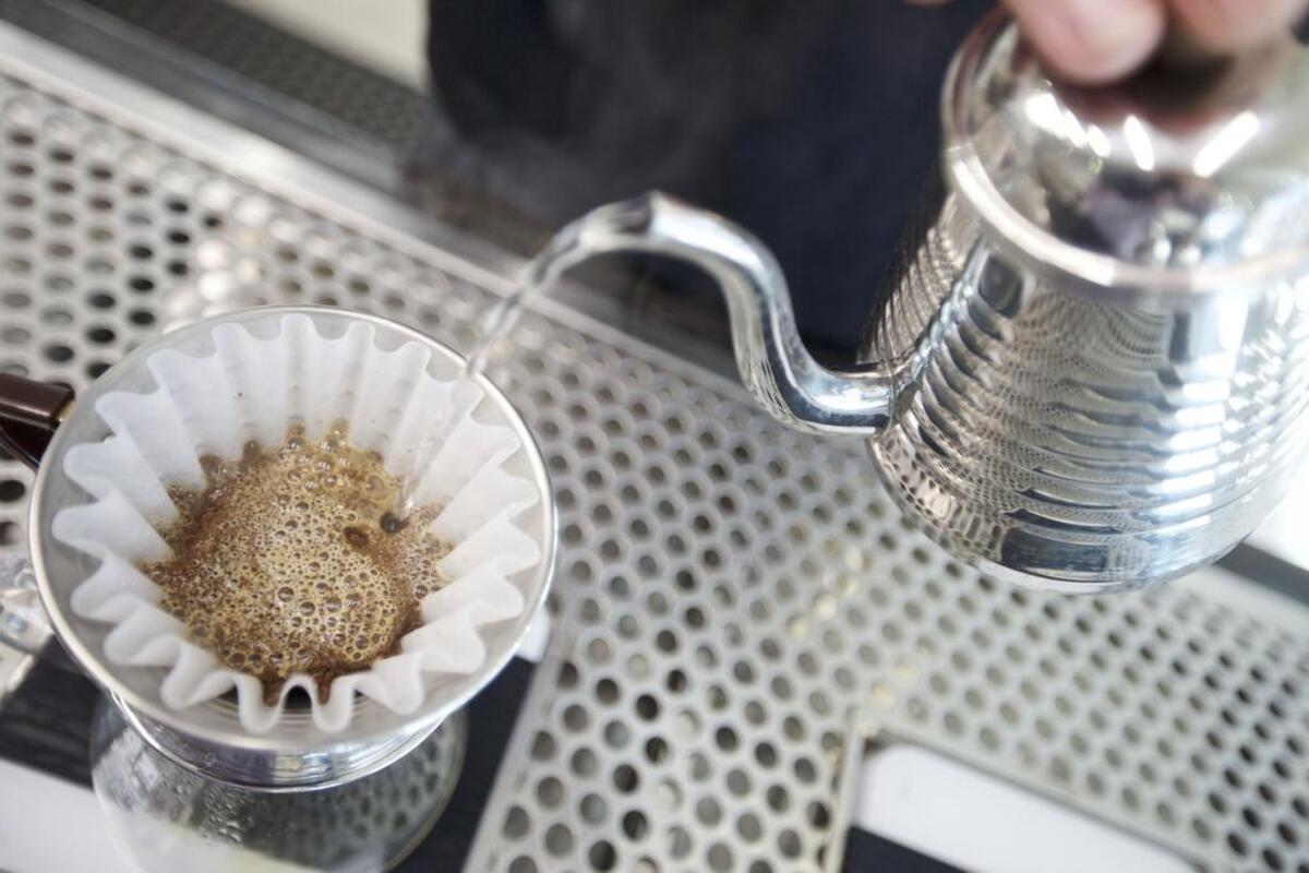 Michael Walker prepares a cup of coffee for a customer at Sons of Liberty Coffee, new on Lancaster Avenue in downtown Fort Worth.
