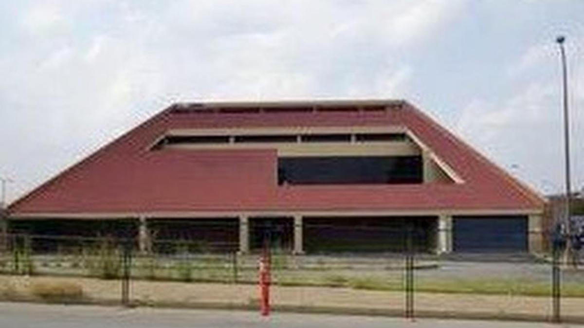 An old bank building will be razed for a hotel and Tim Love bar.