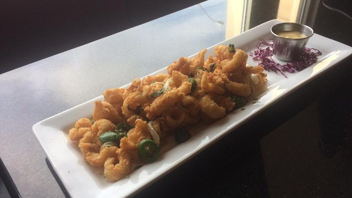 Calamari Tampico (calamari tossed with grilled onions and peppers with Creole dipping sauce) at 3rd Street Bar & Grill in downtown Fort Worth