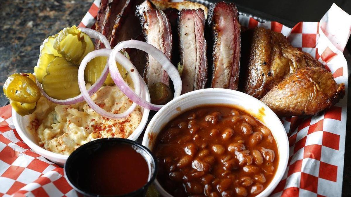A plate with ribs, brisket and chicken at Berry Best BBQ.