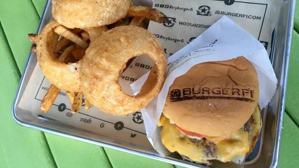 A double cheeseburger with onion rings and fries from BurgerFi, which opened a north Fort Worth location in October. The Florida-based chain also has a location in Arlington’s Champions Park.