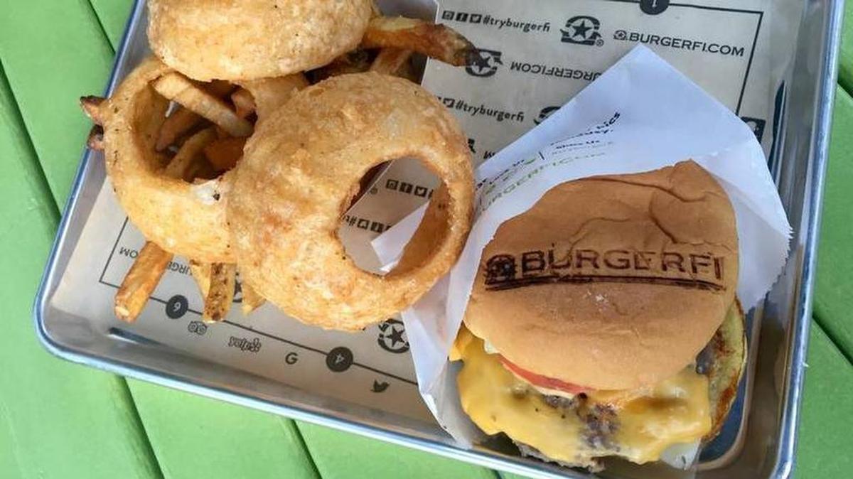 A double cheeseburger with onion rings and fries from BurgerFi, which opened a north Fort Worth location in October. The Florida-based chain also has a location in Arlington’s Champions Park.