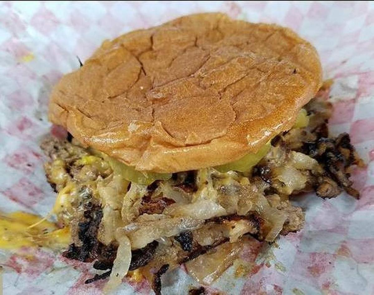 Onions are mashed into the patties at Hooker’s Grill in Fort Worth.