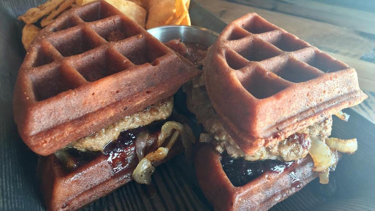 A cheesburger on red-velvet waffles was a recent Breckies special.