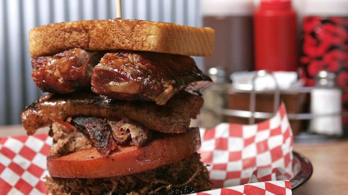 The Jambo Texan combination sandwich at Jambo’s Barbeque Shack features brisket, bologna, pulled pork, sausage and ribs.