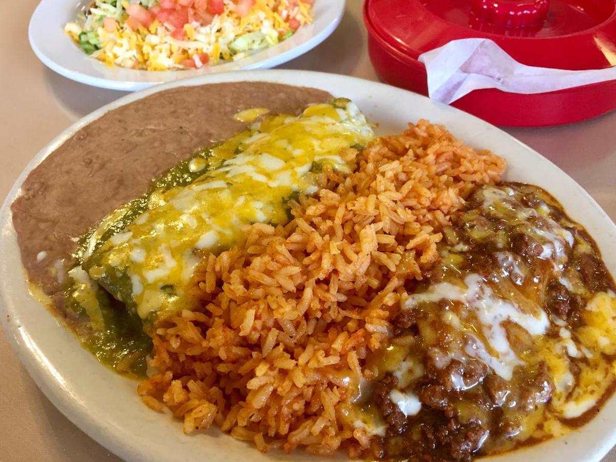A combination plate with a tamal, a green chicken enchilada and a taco at Cardona Foods Cafe.