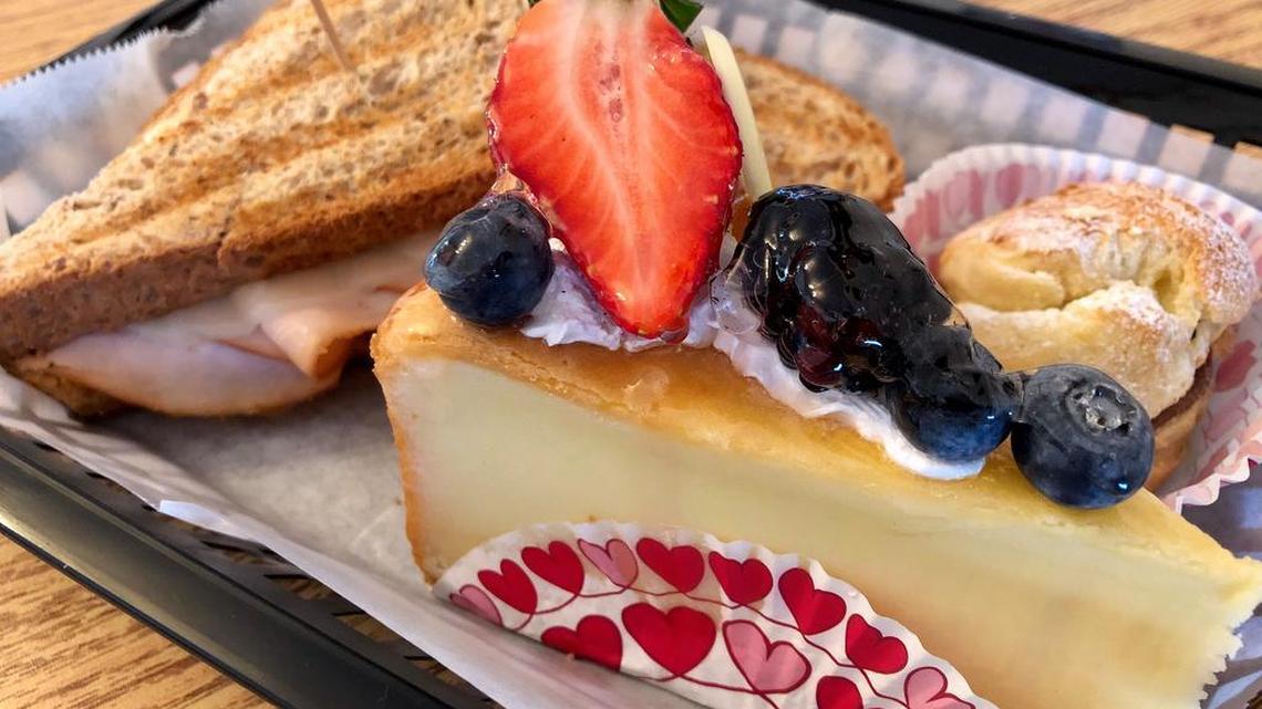 French cheesecake, a turkey sandwich on wheat and a cream puff at Quixote Bakery Cafe in Richland Hills.