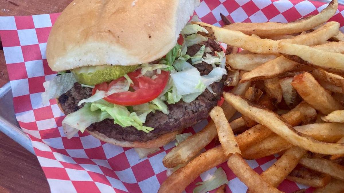 A Ted E’s Kitchen hand-packed burger with fresh-cut french fries costs less than $8.