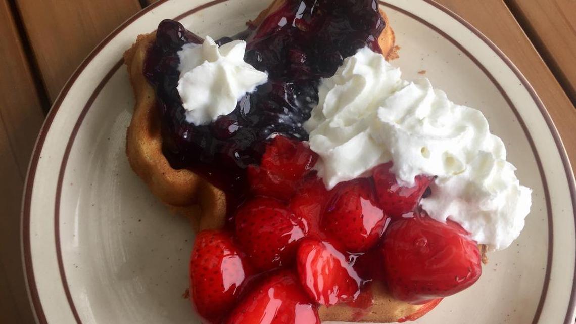 A “Texas Flag” waffle with strawberries, blueberries and whipped cream at Our Place in Burleson.