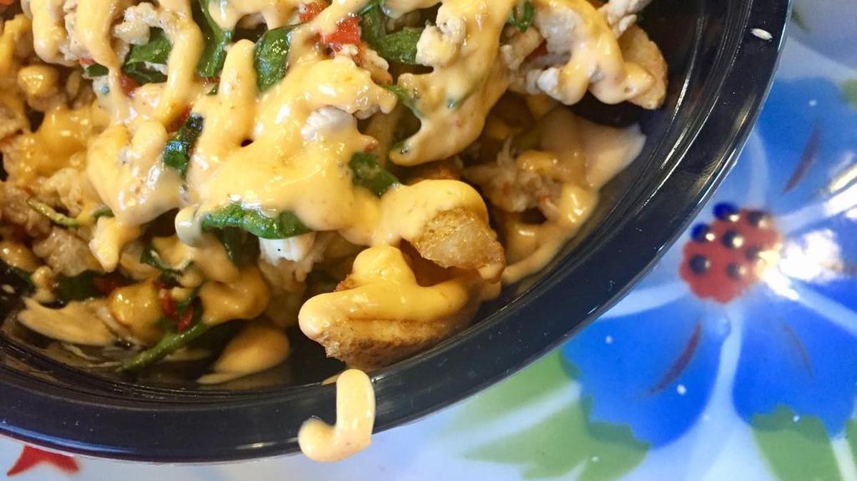Loaded Thai spicy basil wedge fries at Pandan Thai Street Eats in Burleson.