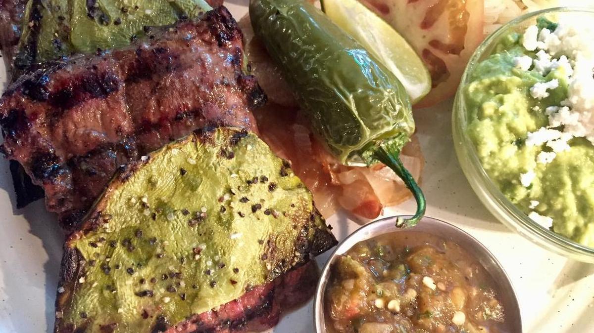 Steak arrachera with cactus and molcajete sauce at Americado.
