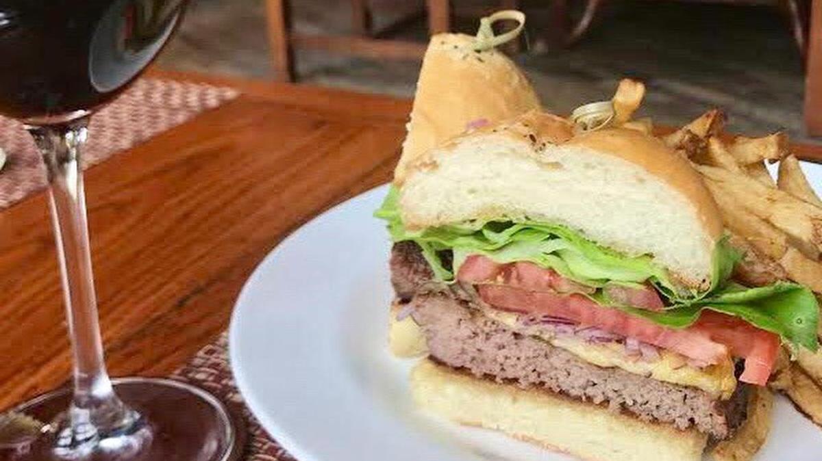 A burger on the bar menu at Rough Creek Lodge.