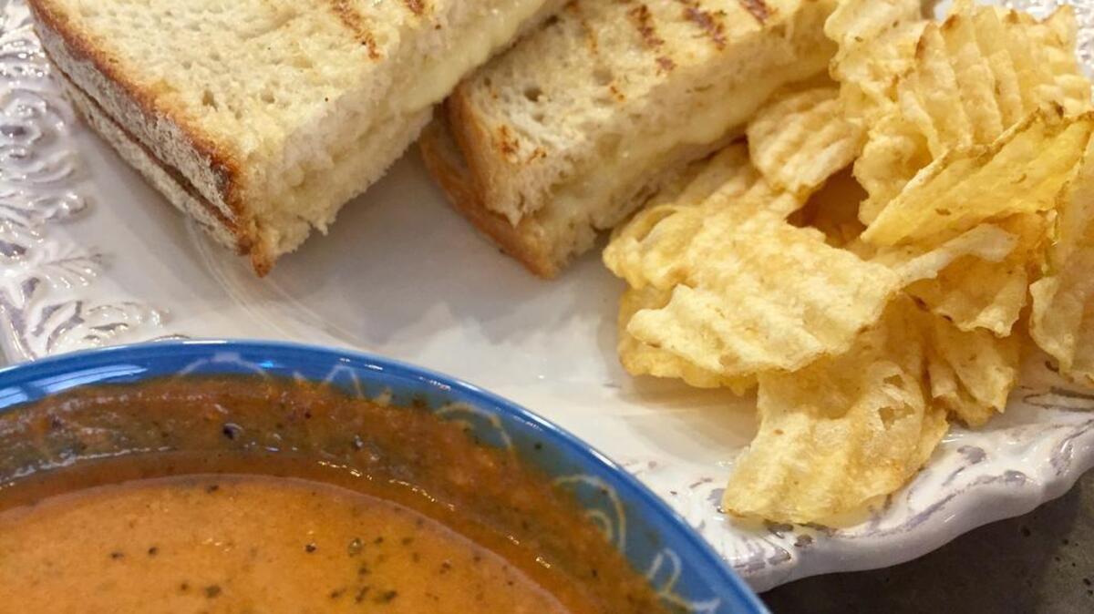 A havarti-Brie grilled cheese sandwich served with tomato-basil soup at Mason & Dixie.