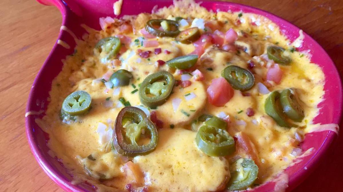 “Irish nachos,” made with potato skins, originated in 1980 at J. Gilligan’s, an Arlington favorite that's not far from AT&T Stadium