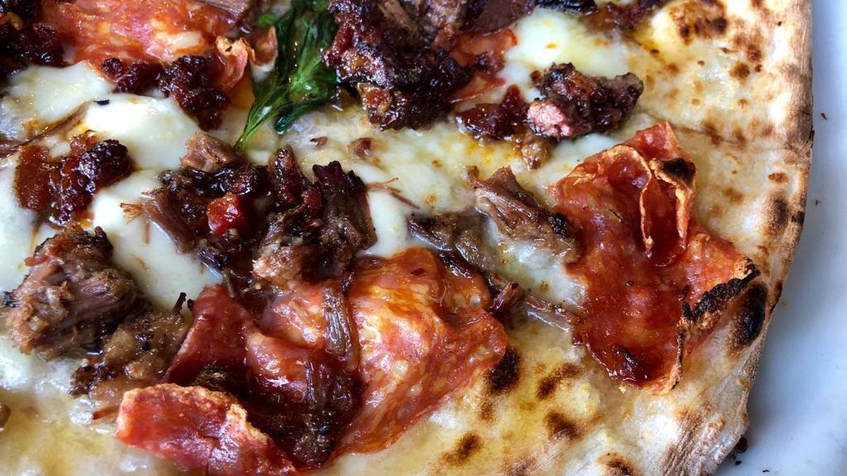 Cane Rosso’s newest pizza combines Heim brisket with soppressata and habanero honey.