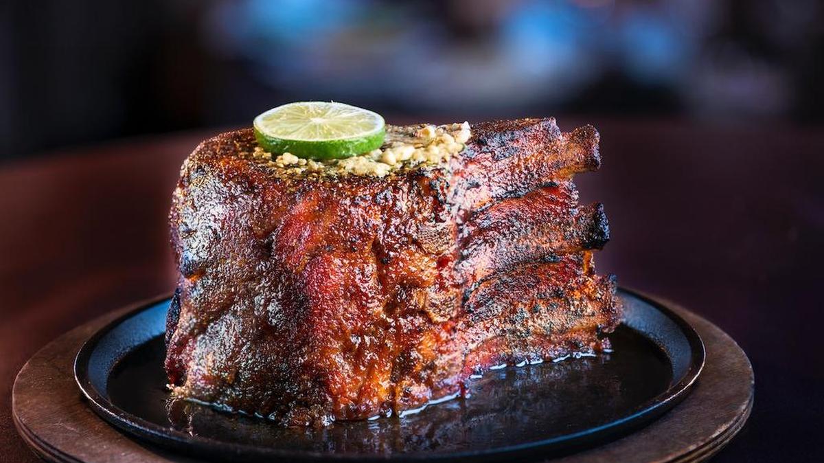 The signature “7-finger” pork chop at Perry’s Steakhouse & Grille, which just opened its first Tarrant location in Grapevine