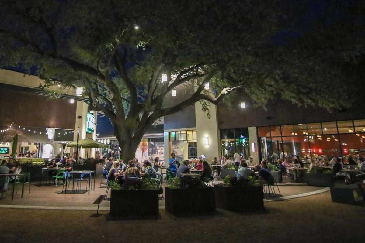 The Grove, at Waterside in Fort Worth, is flanked by the patios at Taco Diner, left, and Piattello Italian Kitchen.