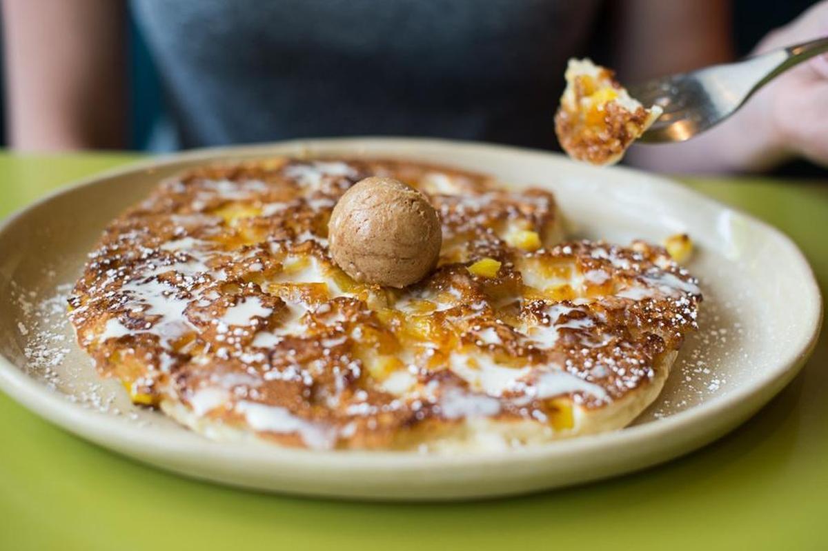 Pineapple upside-down pancakes at Snooze: an AM Eatery — buttermilk pancakes with caramelized pineapple chunks, housemade vanilla crème anglaise and cinnamon butter. The Colorado-based “brunch” chain opened its first Tarrant County location in October at the LeftBank center off West 7th Street in Fort Worth