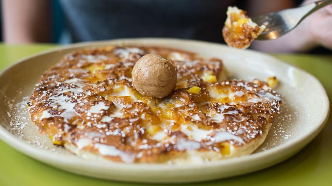 Pineapple upside-down pancakes at Snooze: an AM Eatery — buttermilk pancakes with caramelized pineapple chunks, housemade vanilla crème anglaise and cinnamon butter. The Colorado-based “brunch” chain opened its first Tarrant County location in October at the LeftBank center off West 7th Street in Fort Worth
