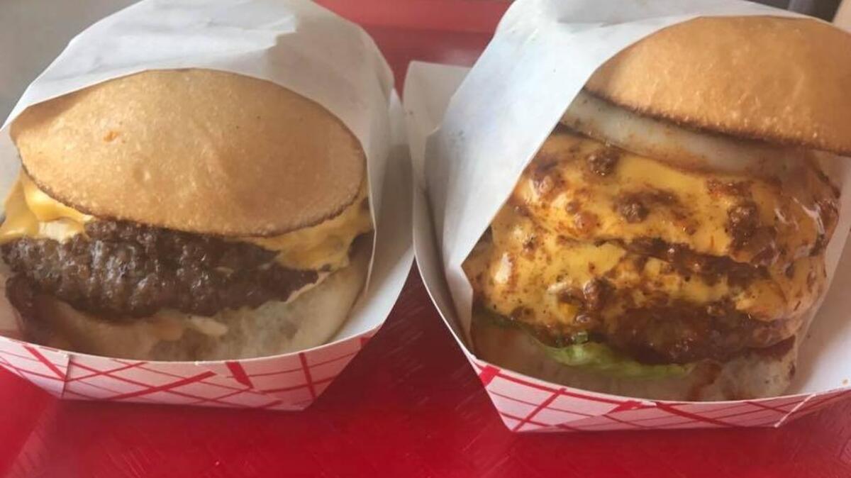 A bacon-cheeseburger and a Dragonburger (topped with chili and jalapeños), in a photo from the Star-Telegram’s 2017 Battle of the Burgers, show off the simplicity and melted-cheesiness of the thin-patty burgers at Johnny B’s in Southlake.