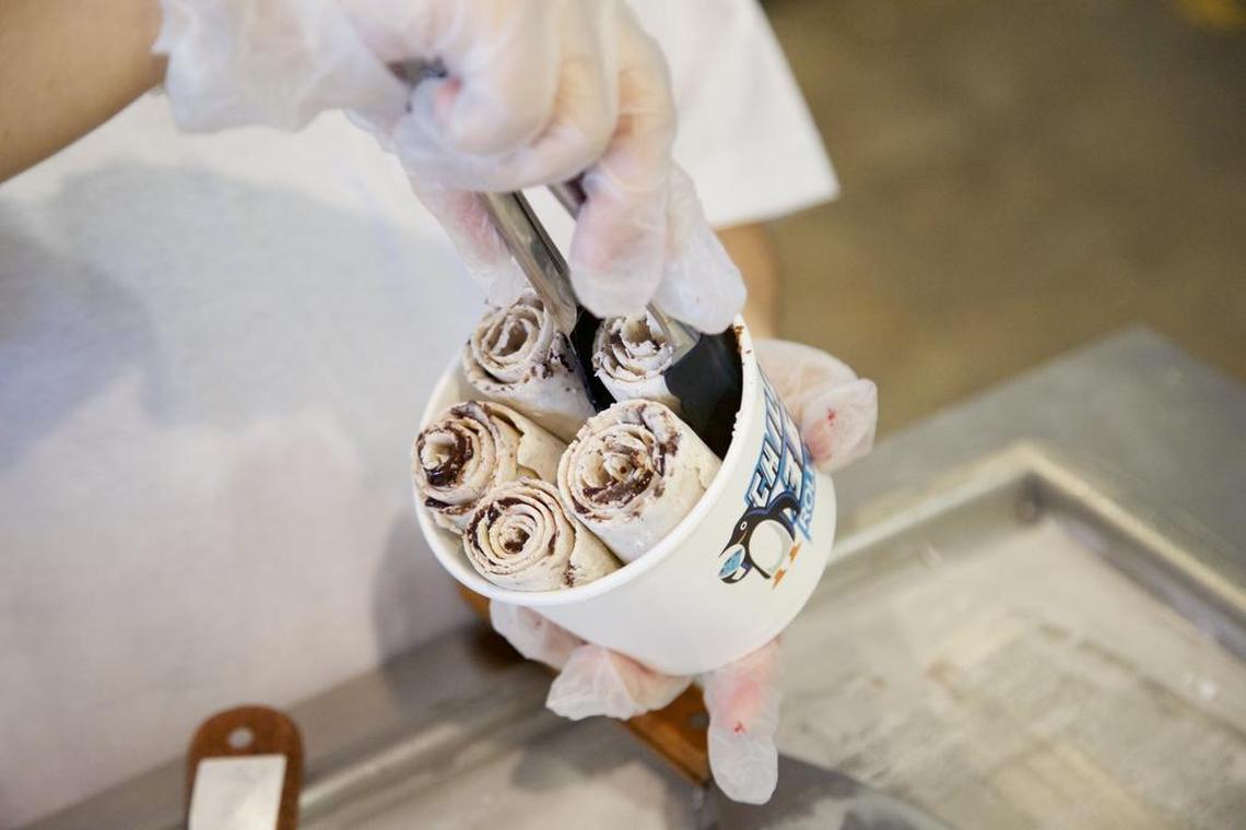 Sanzita Khadka prepares a serving of "What the Fudge" rolled ice cream at Chills 360 in Fort Worth