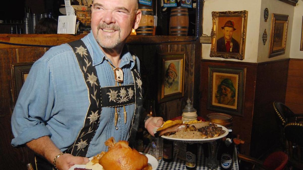 Bernd Schnerzinger holds plates of food at Edelweiss in 2007. 